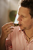 Man eating an oyster