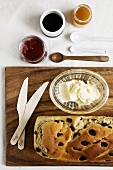 Raisin bread with butter and various spreads