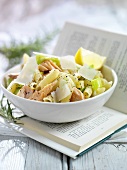 Penne with salmon and leeks on book