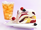 Ice cream cake with berries, iced tea