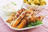 Grilled bacon-wrapped salmon skewers