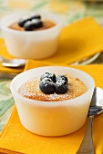 Lemon pudding with blueberries and icing sugar
