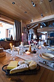 Cheese platter on festive table in country home