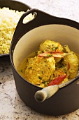 Chicken curry in pan, rice