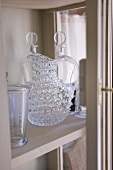 Crystal carafe and glasses on shelf (Château de la Verrerie, France)