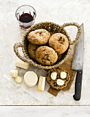 Bread rolls, cheese and red wine