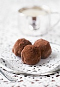 Chocolate truffles on doily