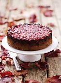 Cranberry upside-down cake on cake stand