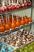 Assorted toffee apples on shelves