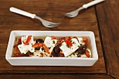 Marinated feta with olives, peppers and herbs