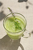 Cold cucumber soup with mint in glass