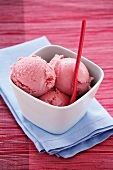 Strawberry yoghurt ice cream in a dish