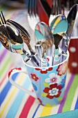 Cutlery in colourful mug