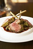 Lamb chops with herb crust and olive sauce