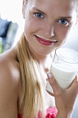 Young woman with milk around her mouth
