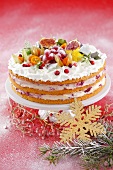 Layer cake with cherry cream, meringue and fruit