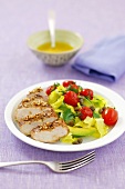 Chicken breast with avocado and cocktail tomatoes