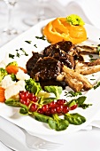 Lamb chops with vegetables and redcurrants