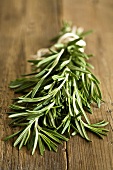 Fresh rosemary on wooden background