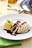 Pear with chocolate sauce and vanilla ice cream
