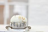 Hard-boiled egg on egg slicer