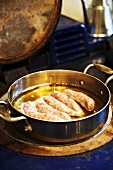 Poaching sausages in beer