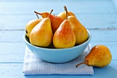 Several pears in blue bowl