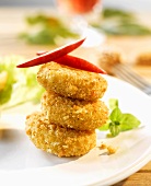 Breaded and deep-fried mini-Camemberts, stacked