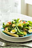 Spinach salad with boiled eggs, baby corn and croutons