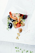 Scampi, lentils, olives and button mushrooms in sewn bag