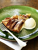 A piece of apple pie with vanilla ice cream