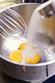 Adding sugar to egg yolks