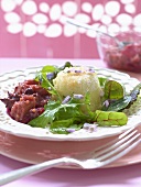 Rhubarb chutney with baked goat's cheese on salad leaves