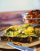 Scrambled egg with ramsons (wild garlic) on wholemeal bread