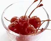 Cocktail cherries in a small dish
