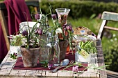 Fritillaries in flip-top bottles & flowerpots (table decoration)