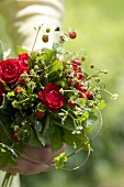 Posy of wild strawberries and roses