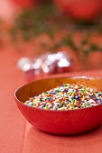 Sprinkles in a small red bowl