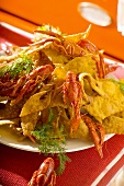 Faworki (fried pastries) with freshwater crayfish, Poland