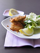 Fried lemon and chilli chicken with endive and corn salad