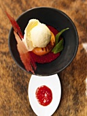 Grilled peach with rosemary ice cream & raspberry brittle