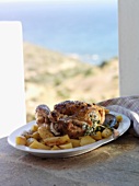 Roast chicken with sheep's cheese and potatoes (Greece)
