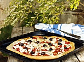 Greek pizza with olives and sheep's cheese