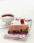 Raspberry ice cream cake with chocolate and walnut base