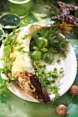 Pike with herbs on cream sauce