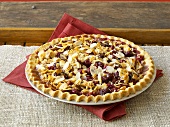 Cranberry tart with flaked almonds