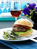 Burger with pea and asparagus salad