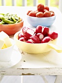 Three dishes of fresh vegetables (for crudités)