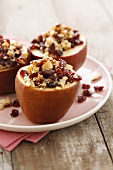 Baked apples with cranberries, Brazil nuts and maple syrup