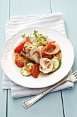 Chicken roulade on tomatoes and courgettes